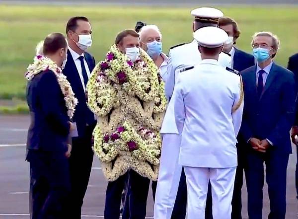 Was President Macron Covered in Garlands in French Polynesia?