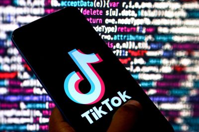 In this photo illustration, a Tiktok logo is displayed on a
