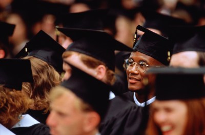 Graduates at a college graduation ceremony.
