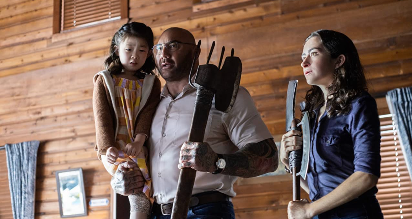 (Kristen Cui, Dave Bautista, and Abby Quinn in 'Knock at the Cabin.' Image via IMDb.)