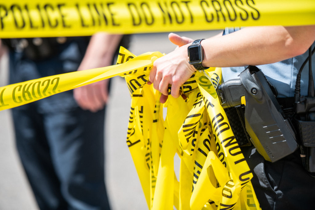 Police tape at a crime scene. (Photo by Brandon Bell/Getty Images)