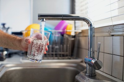 Man holding a glass of water