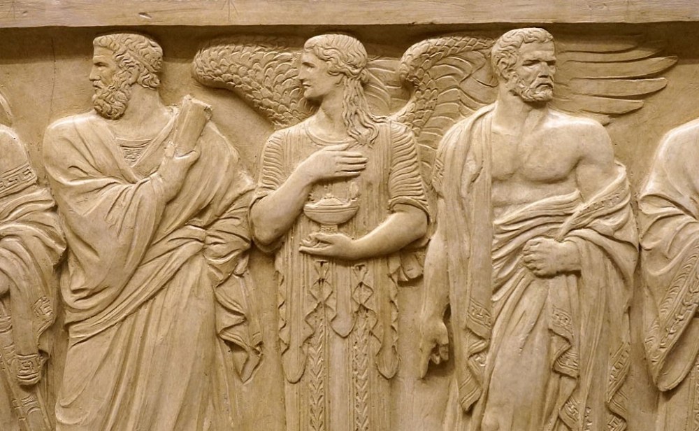 The figure of Solon and a representation of the Light of Wisdom. At the right is Draco.