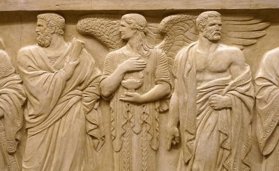 The figure of Solon and a representation of the Light of Wisdom. At the right is Draco.