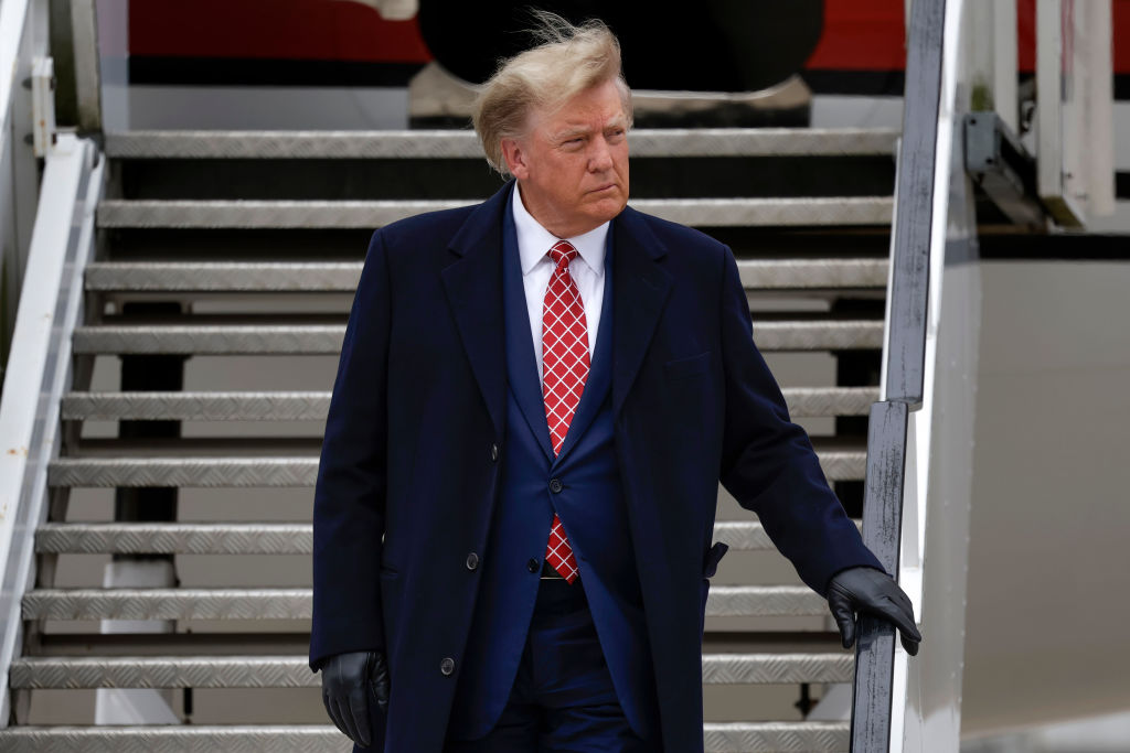 Former U.S. President Donald Trump disembarks his plane at Aberdeen Airport.  (Photo by Jeff J Mitchell/Getty Images)