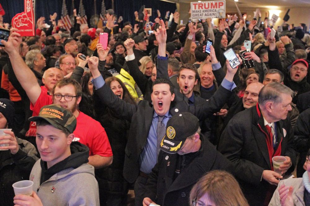 (Manchester, NH, 02/09/16) Supporters celebrate as they find out that republican presidential candidate Donald Trump has won the NH primary during his victory party at Executive Court Banquet Facility on Monday, February 9, 2016. Staff photo by Matt