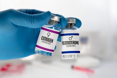Doctor With bottles for Testosterone and Estrogen hormonal balance therapy