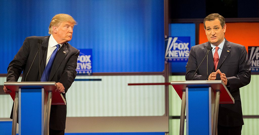 Ted Cruz responds to a question as Donald Trump listens during the Republican presidential debate in Detroit, Michigan, March 3, 2016. (Photo credit should read Geoff Robinson/AFP/Getty Images)