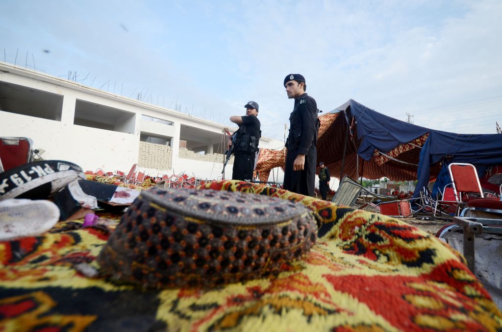 Security personnel inspect the site of a suicide attack in the Khyber Pakhtunkhwa province of northwestern Pakistan on July 31, 2023. (Photo by Str/Xinhua via Getty Images)