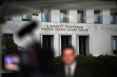 WASHINGTON, DC – AUGUST 3: A journalist reports outside the  El