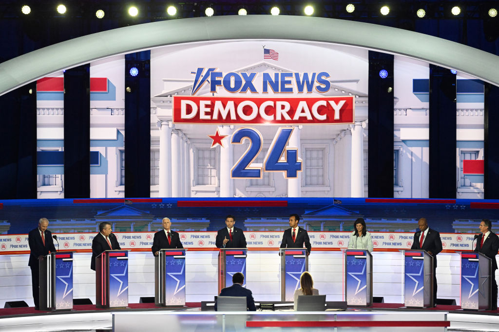 Republican presidential candidates at the first GOP presidential primary debate in Milwaukee, Wisconsin, on Wednesday, August 23, 2023. From left to right: Former Arkansas Gov. Asa Hutchinson, former New Jersey Gov. Chris Christie, former Vice President Mike Pence, Florida Gov. Ron DeSantis, biotech entrepreneur Vivek Ramaswamy, former U.N. Ambassador Nikki Haley, Sen. Tim Scott, and North Dakota Gov. Doug Burgum. (Photo by Joshua Lott/The Washington Post via Getty Images)