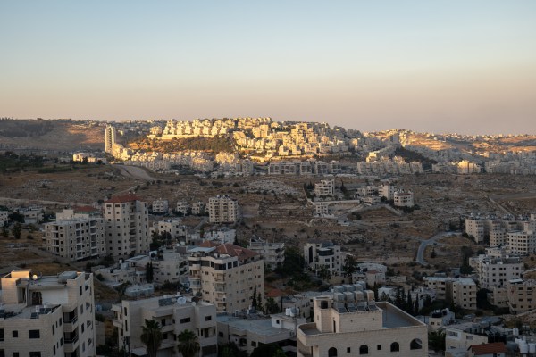 Bethlehem, West Bank, Palestine – 22 July 2022: Cityscape at Dusk with Last Sun Rays Over the White Stone Buildings
