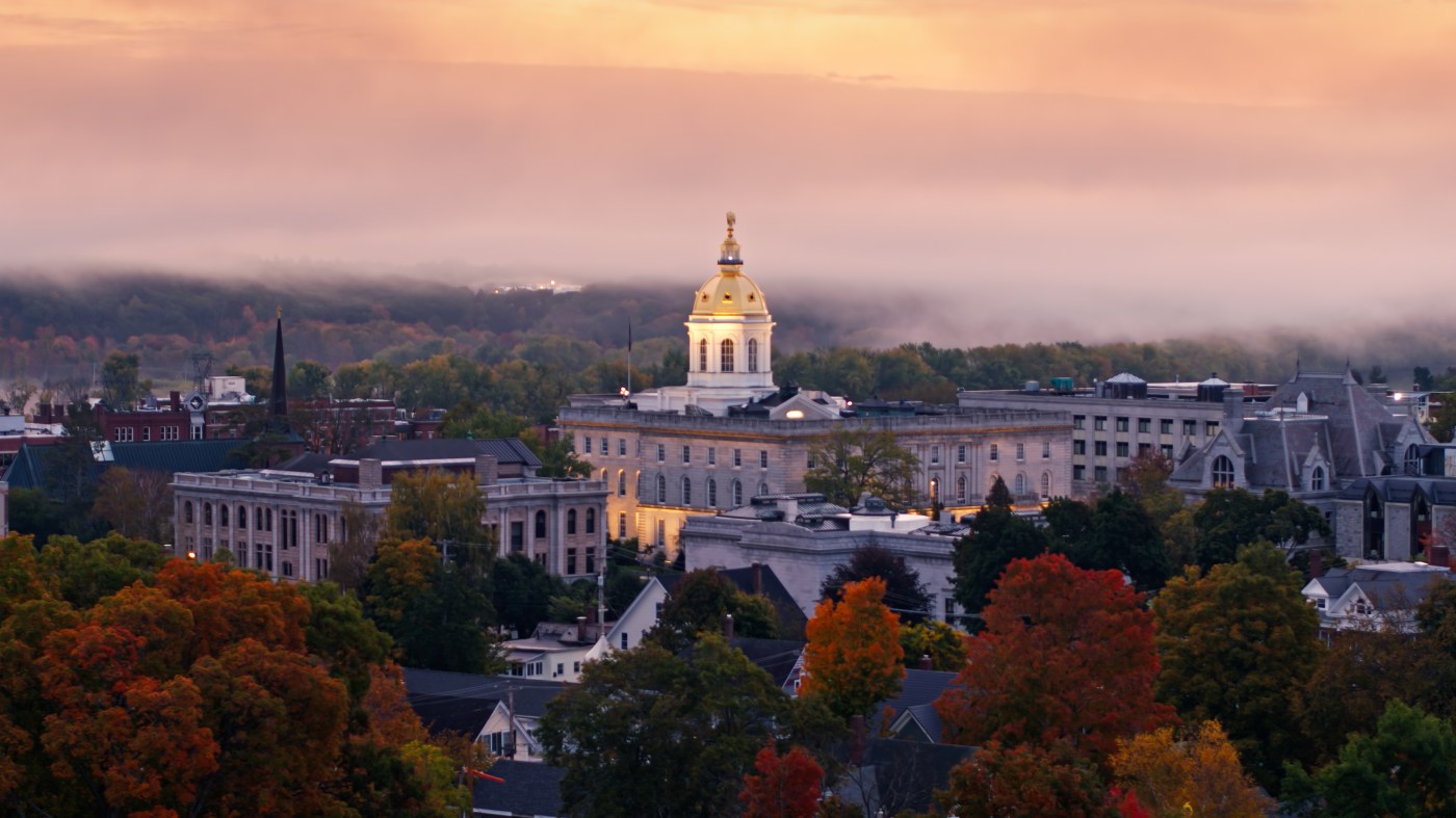 Low Aerial Shot of New Hampshire State House on Foggy Morning