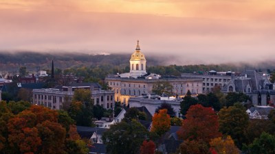 Low Aerial Shot of New Hampshire State House on Foggy Morning