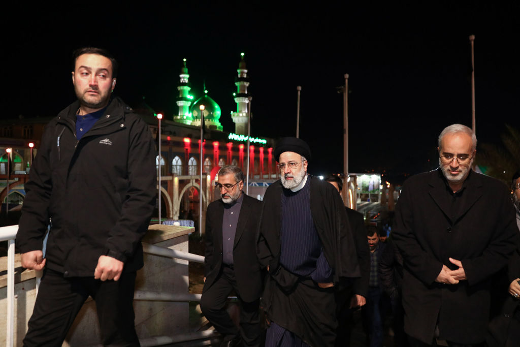 Iranian President Ebrahim Raisi visits the grave of Iranian General Qassem Suleimani on January 05, 2024, days after two explosions ripped through a crowded area on the anniversary of Suleimani's death. (Photo by Iranian Presidency / Handout/Anadolu via Getty Images)