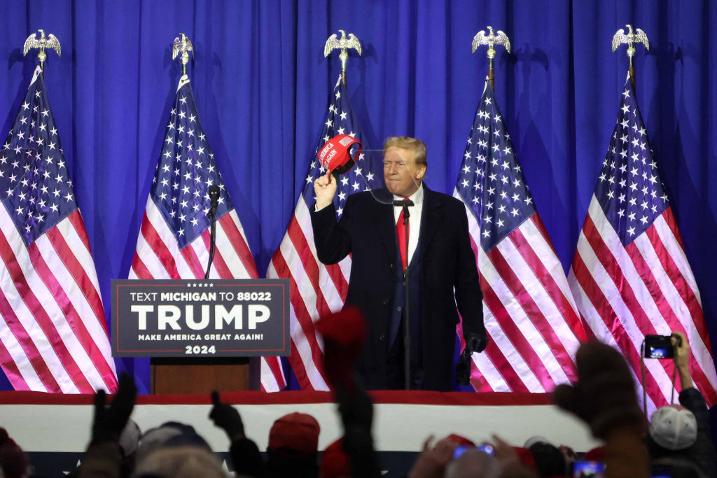 Former President Donald Trump gestures during a "Get Out the Vote" rally in Waterford Township, Michigan, on February 17, 2024. (Photo by ALEX WROBLEWSKI/AFP via Getty Images)