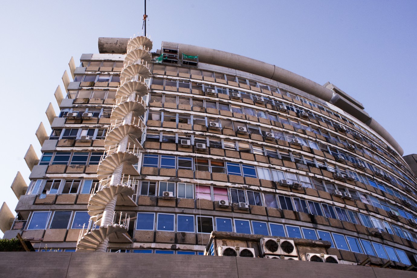 A residential building in central Tel Aviv shows blown-out windows and other damage from the blast caused by a Houthi drone attack on July 19, 2024. (Photo by Charlotte Lawson/The Dispatch)