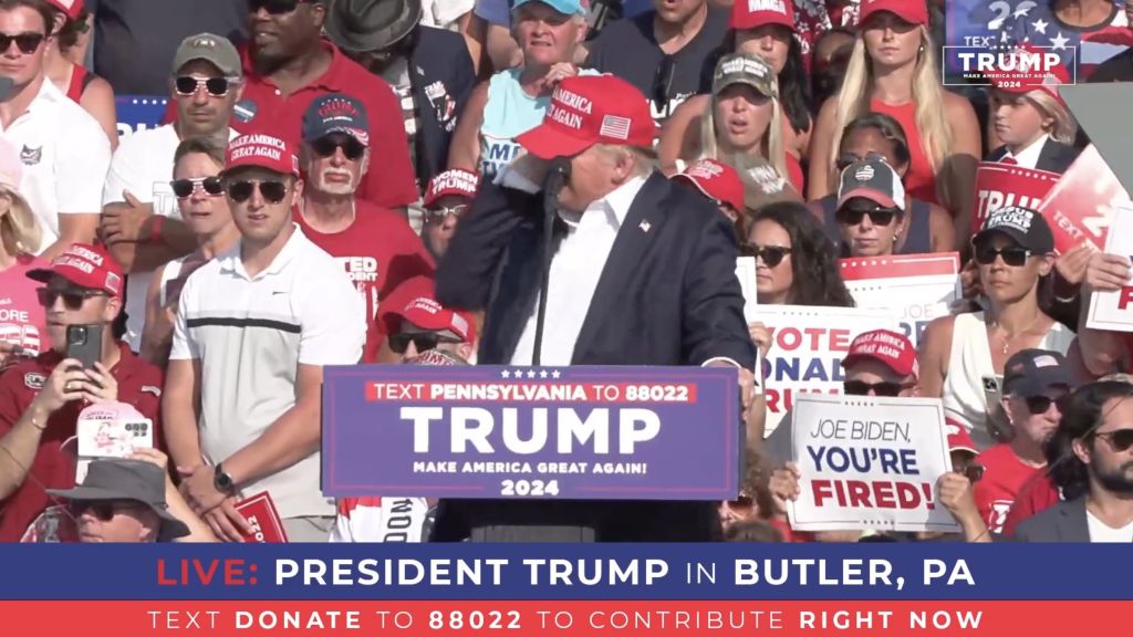 A screen grab captured from a video shows former President Donald Trump after gunshots were during a rally in Butler, Pennsylvania, on July 13, 2024. (Photo by Trump Campaign Office/Handout/Anadolu via Getty Images)