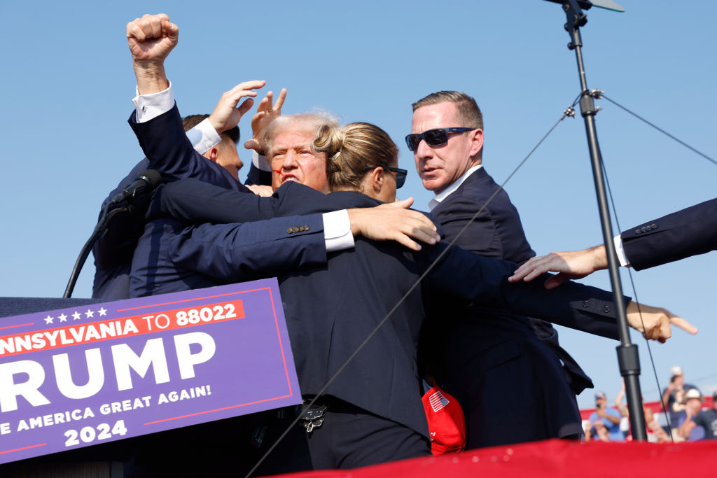 Former President Donald Trump is rushed offstage during a rally in Butler, Pennsylvania, on July 13, 2024. (Photo by Anna Moneymaker/Getty Images)