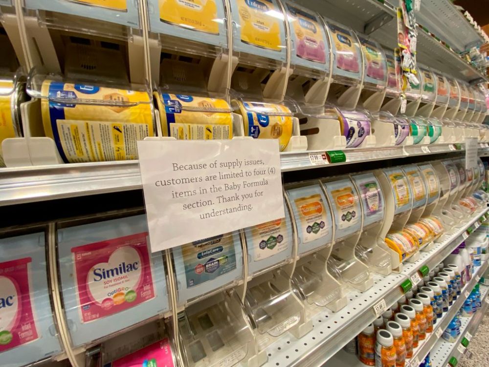 Shelves of baby formula with sign about customer limits due to supply shortage, Publix, West Palm Beach, Florida