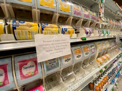 Shelves of baby formula with sign about customer limits due to supply shortage, Publix, West Palm Beach, Florida
