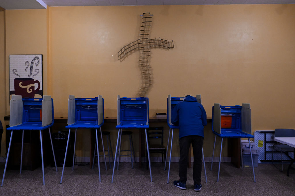 A Voters Fills Out Their Ballot At A Polling Station In Green Bay Wisconsin