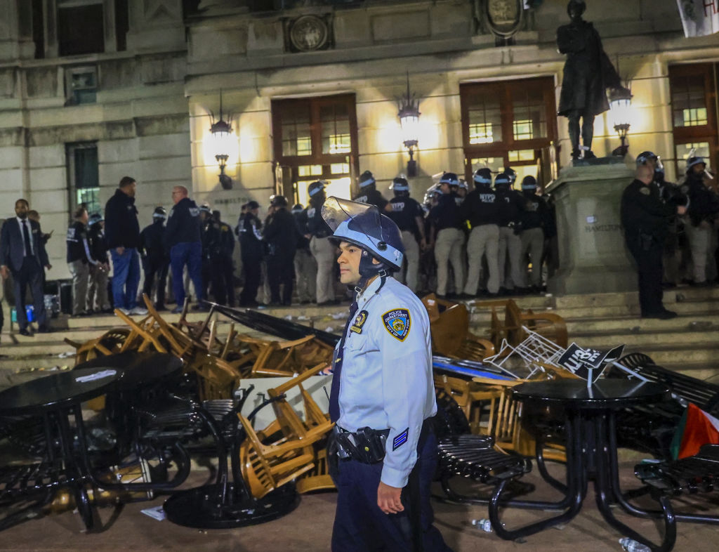 New York Police Department officers detain dozens of pro-Palestinian students at Columbia University after they barricaded themselves at the Hamilton Hall building near the Gaza Solidarity Encampment on April 30, 2024.(Photo by Selcuk Acar/Anadolu via Getty Images)