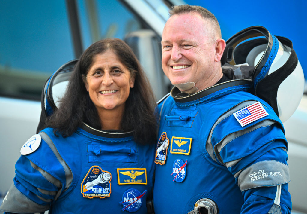 NASA astronauts Butch Wilmore and Suni Williams, wearing Boeing spacesuits, depart the Neil A. Armstrong Operations and Checkout Building at Kennedy Space Center for Launch Complex 41 at Cape Canaveral Space Force Station in Florida to board the Boeing CST-100 Starliner spacecraft for the Crew Flight Test launch, on June 5, 2024. (Photo by MIGUEL J. RODRIGUEZ CARRILLO/AFP via Getty Images)