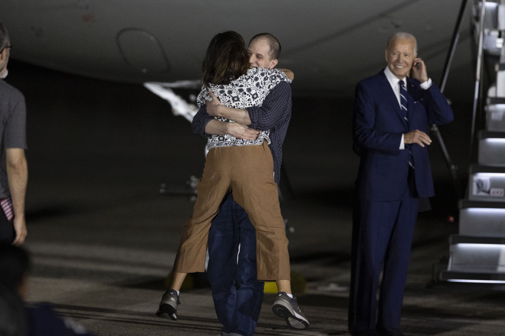 Evan Gershkovich's mother, Ella Milman, welcomes her son at Joint Base Andrews in Maryland on August 1, 2024, as he returns to the United States after more than a year in Russian captivity. (Photo by Mostafa Bassim/Anadolu via Getty Images)