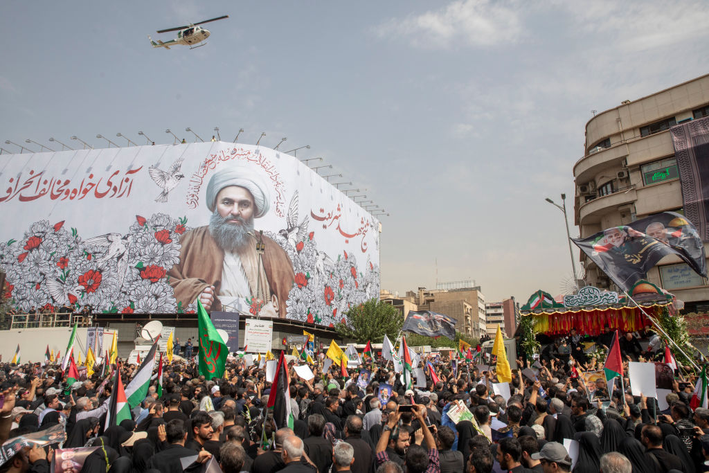 Iranians attend a funeral ceremony held for Hamas political chief Ismail Haniyeh in Tehran on August 1, 2024. (Photo by Majid Saeedi/Getty Images)