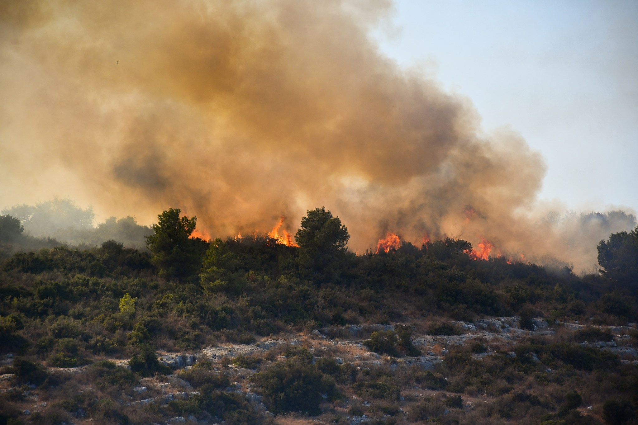 Hezbollah rockets spark a fire between the border communities of Matzuva and Ya'ara on September 12, 2024. (Photo by Charlotte Lawson)