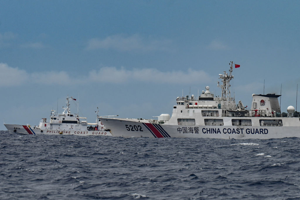 A Chinese Coast Guard ship is seen near a Philippine Coast Guard ship in disputed waters of the South China Sea on August 26, 2024. (Photo by JAM STA ROSA/AFP via Getty Images)