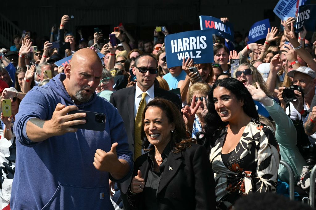 Vice President Kamala Harris, Pennsylvania Sen. John Fetterman. and his wife Gisele Barreto Fetterman take a selfie with supporters at a campaign event in Johnstown, Pennsylvania, September 13, 2024. (Photo by Drew Angerer/AFP/Getty Images)