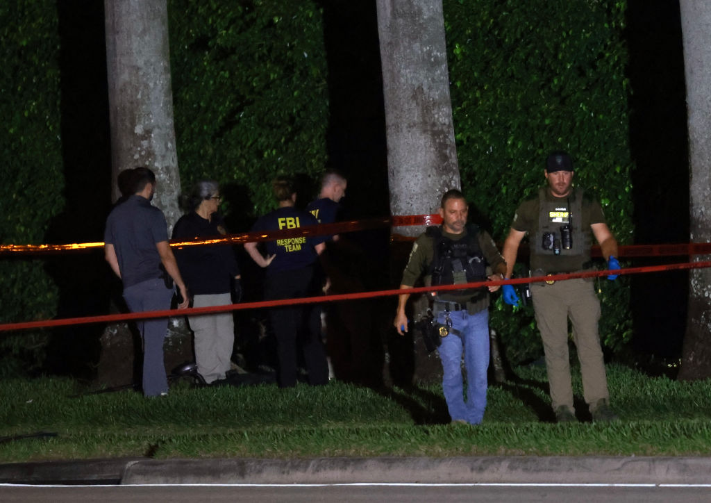 Law enforcement personnel investigate the area around Trump International Golf Club in West Palm Beach, Florida, on September 15, 2024, after an apparent assassination attempt on former President Donald Trump. (Photo by Joe Raedle/Getty Images)