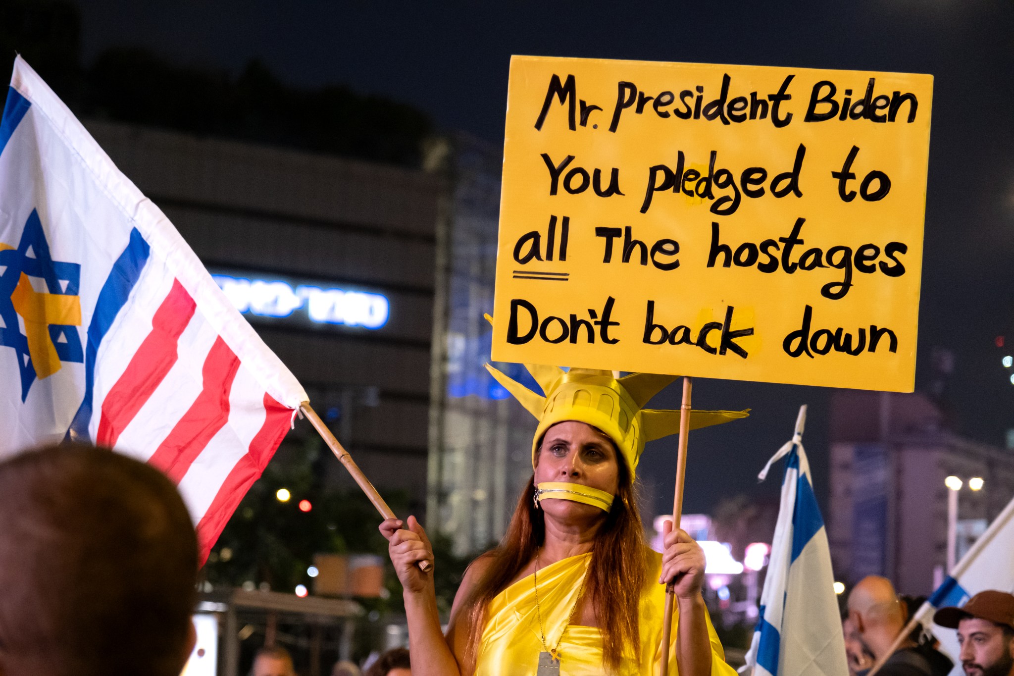 A demonstrator appeals to President Joe Biden during protests in Tel Aviv on September 7, 2024. (Photo by Charlotte Lawson.)
