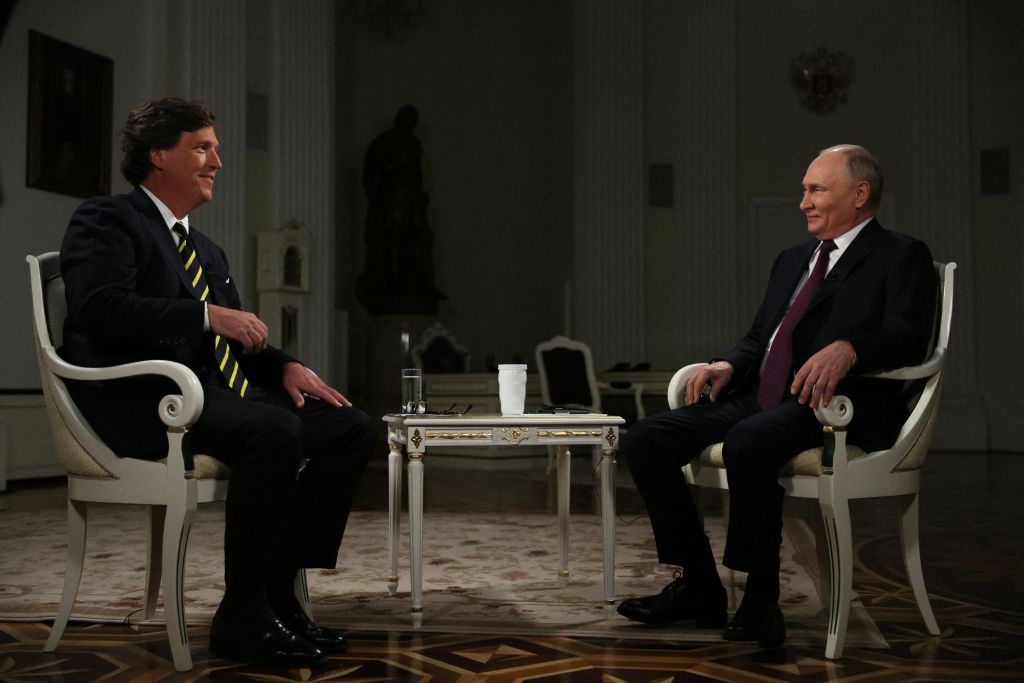 Russian President Vladimir Putin talks with Tucker Carlson at the Kremlin in Moscow on February 6, 2024. (Photo by GAVRIIL GRIGOROV/POOL/AFP via Getty Images)