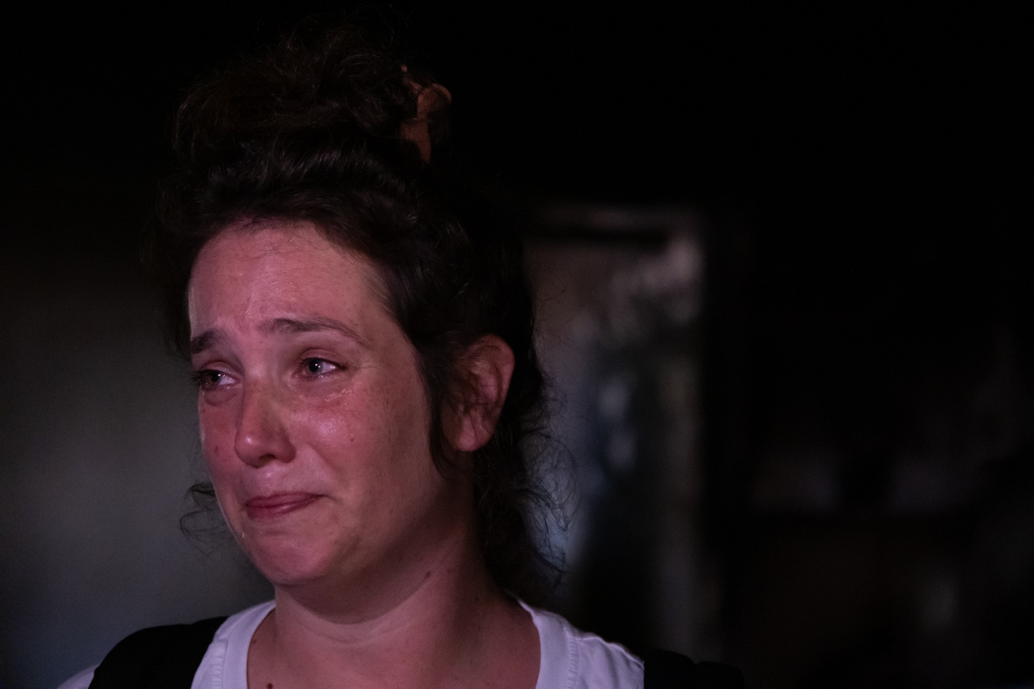 Yifat Zailer, the cousin of hostage Shiri Bibas, speaks inside the remains of the kindergarten in Nir Oz, which was attacked by Hamas on October 7. (Photo by Charlotte Lawson.)
