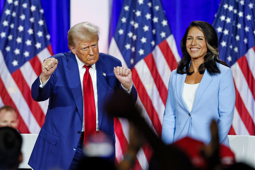 Former President Donald Trump dances as he leaves the stage after speaking alongside former Rep. Tulsi Gabbard during a town hall meeting in La Crosse, Wisconsin, on August 29, 2024. (Photo by KAMIL KRZACZYNSKI/AFP via Getty Images)