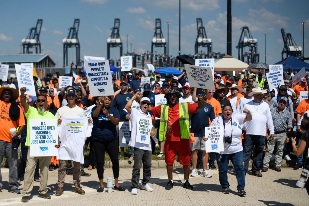 Dockworkers gather at the Bayport Container Terminal in Seabrook, Texas, on October 1, 2024. (Photo by MARK FELIX/AFP via Getty Images)