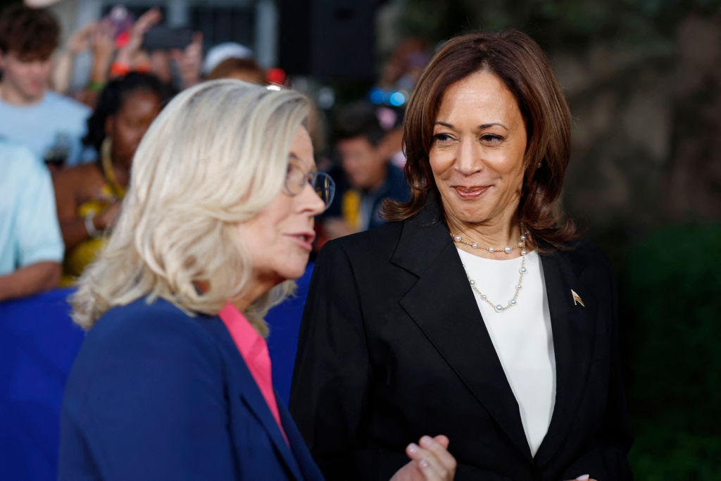 Vice President Kamala Harris listens to former Rep. Liz Cheney speak to the press following a campaign event at Ripon College in Ripon, Wisconsin, on October 3, 2024. (Photo by Kamil Krzaczynski/AFP/Getty Images)