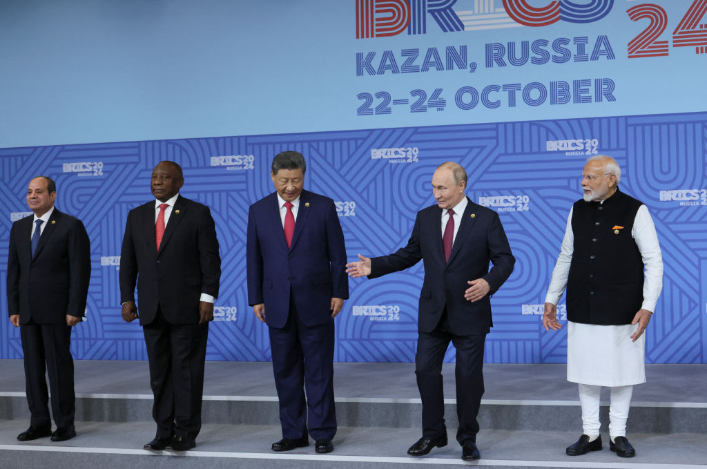 Egyptian President Abdel Fattah al-Sisi, South African President Cyril Ramaphosa, Chinese President Xi Jinping, Russian President Vladimir Putin, and Indian Prime Minister Narendra Modi attend a family photo during the BRICS summit in Kazan on October 23, 2024. (Photo by MAXIM SHIPENKOV/POOL/AFP via Getty Images)