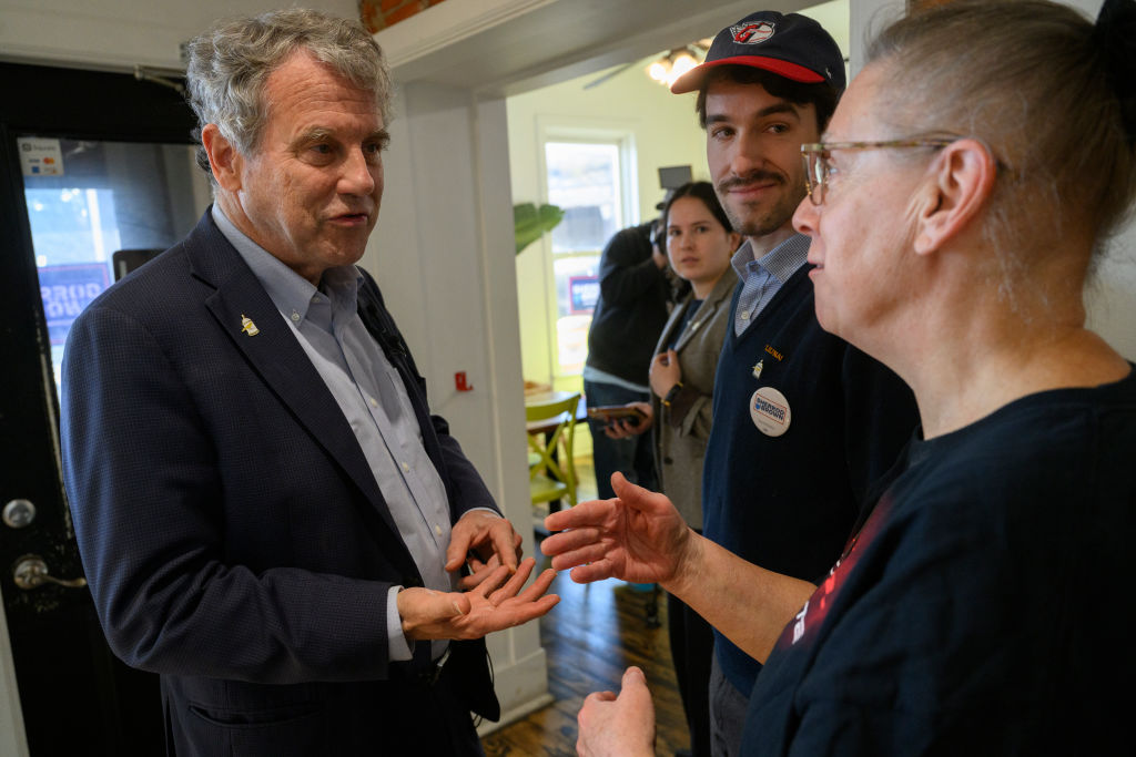 Democratic Sen. Sherrod Brown speaks with a voter during a campaign stop at Yonder Brunch and Vibe, on October 30, 2024, in Cleveland, Ohio. (Photo by Jeff Swensen/Getty Images)