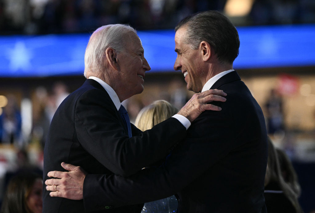 President Joe Biden and his son Hunter hug on stage at the conclusion of the first day of the Democratic National Convention in Chicago, Illinois, on August 19, 2024. (Photo by BRENDAN SMIALOWSKI/AFP via Getty Images)