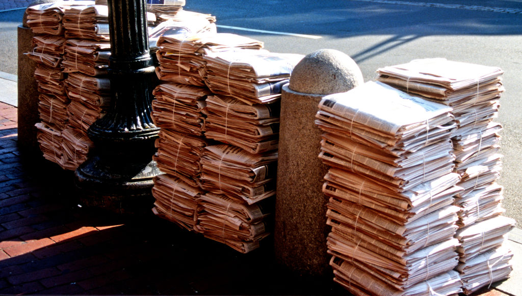 Sunday Morning Newspapers on a City Sidewalk