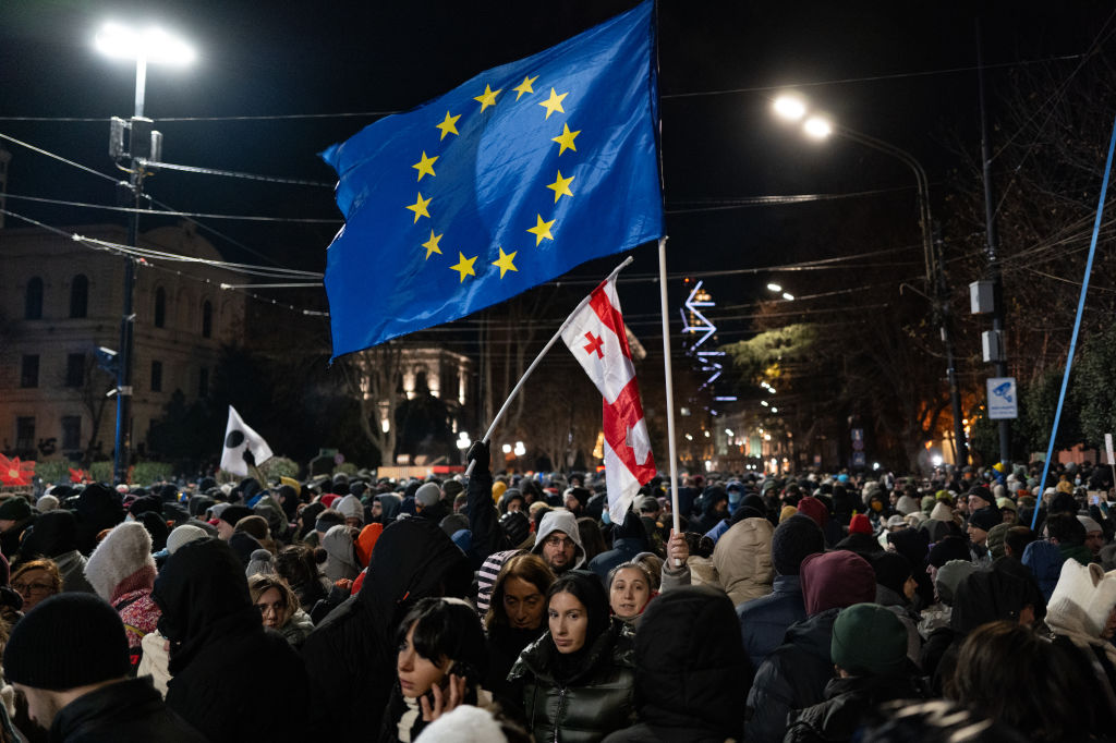 Anti-government demonstrators gather outside the Georgian parliament in Tbilisi, Georgia, on December 14, 2024. (Photo by Jerome Gilles/NurPhoto via Getty Images)