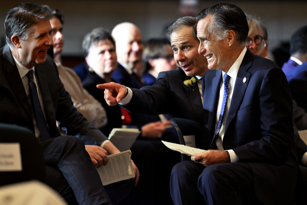 Sen. Mitt Romney visits with Rep. John Curtis (second from right) and other guests during the dedication ceremony for the statue of Martha Hughes Cannon in the U.S. Capitol Visitors Center on December 11, 2024, in Washington, D.C. (Photo by Chip Somodevilla/Getty Images)