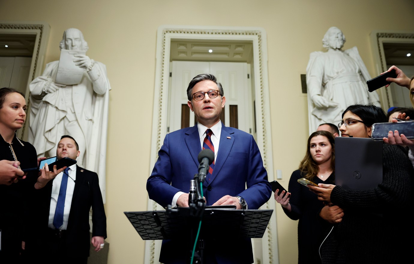 House Speaker Mike Johnson speaks to reporters outside of the House Chambers in the U.S. Capitol on December 19, 2024, in Washington, D.C. (Photo by Kevin Dietsch/Getty Images)