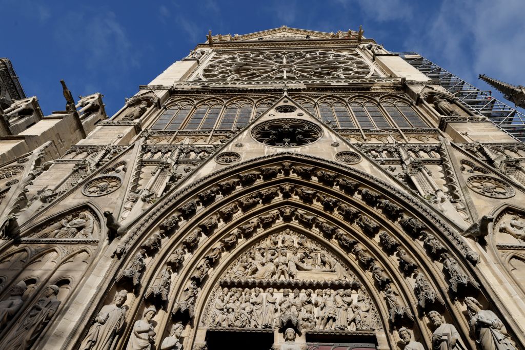 A photo shows the entrance "Le Portail du Cloitre" (The Cloister Portal) on the north façade of the Notre-Dame de Paris cathedral, ahead of its official reopening ceremony after more than five years of reconstruction work following the April 2019 fire, in Paris on December 7, 2024. (Photo by LUDOVIC MARIN/POOL/AFP via Getty Images)