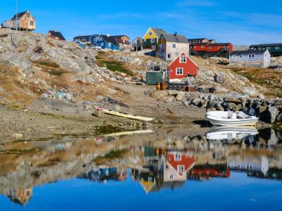 Little Inuit village Tinit (Tiilerilaaq) at the shore of the Sermilik (Sermiligaaq) icefjord in the area Ammassalik in East Greenland. North America, Greenland, Ammassalik, Danish territory, autumn