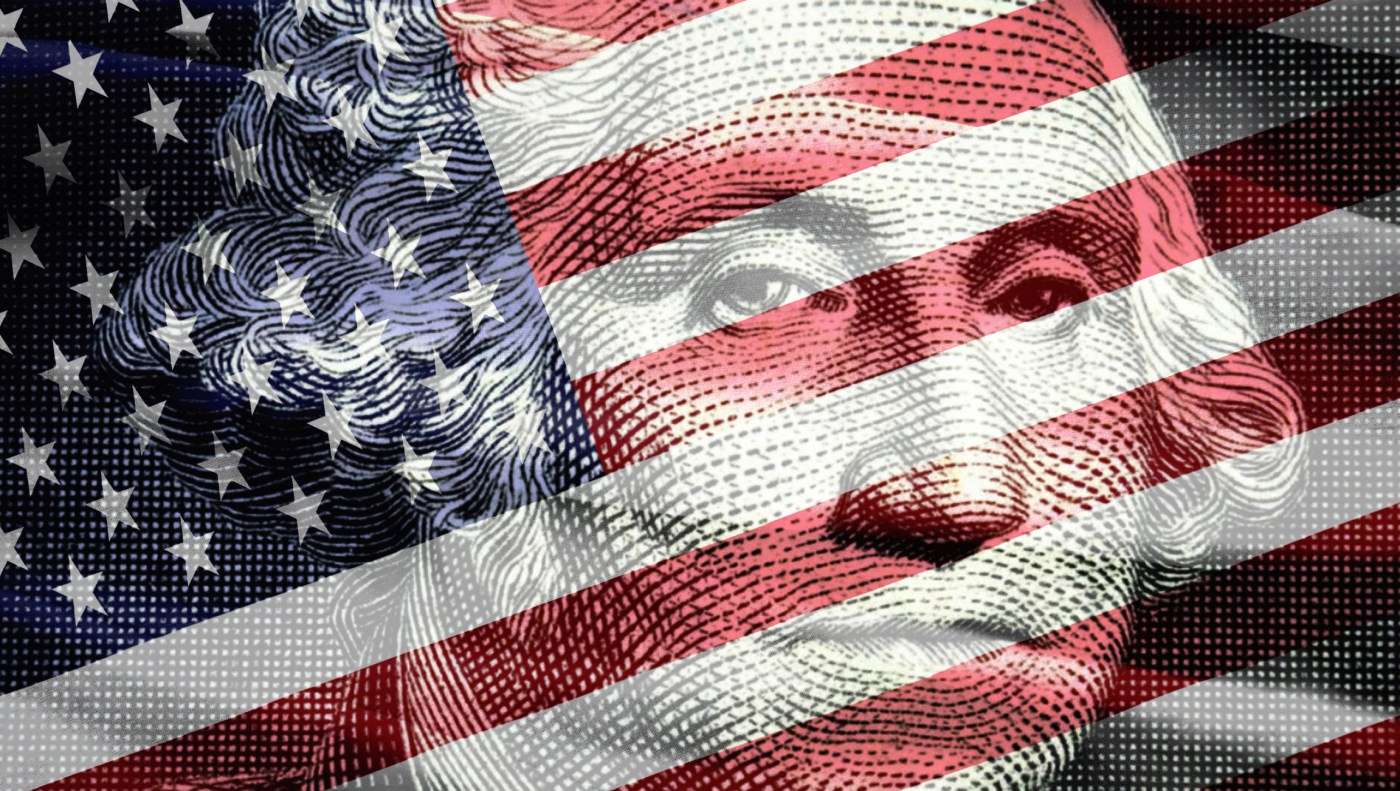 George Washington’s portrait on the one-dollar bill alongside the US flag